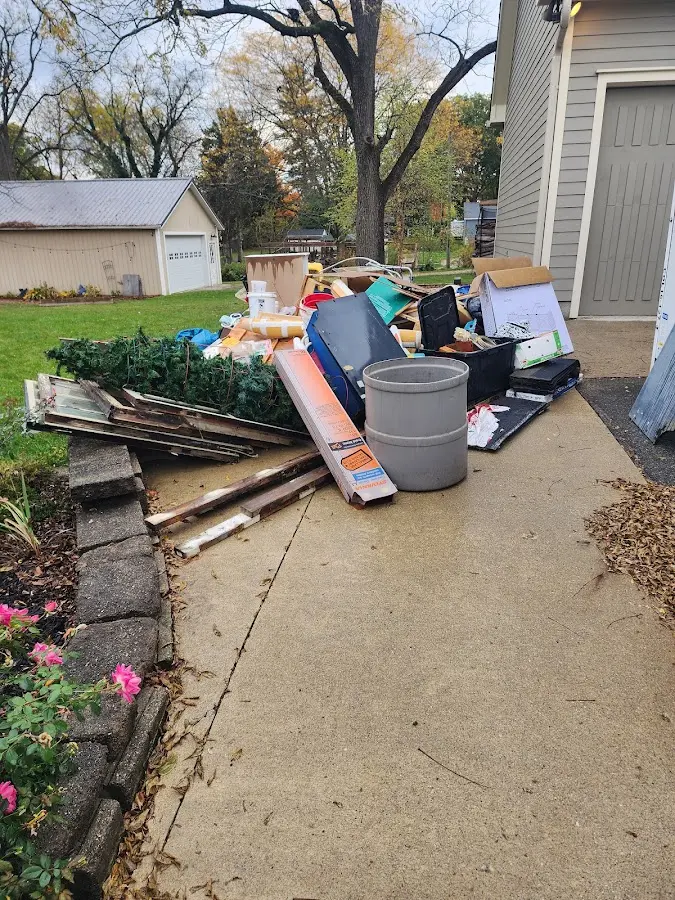 Dumpster being loaded with debris for Estate Cleanout Dumpster Rental in Old Town